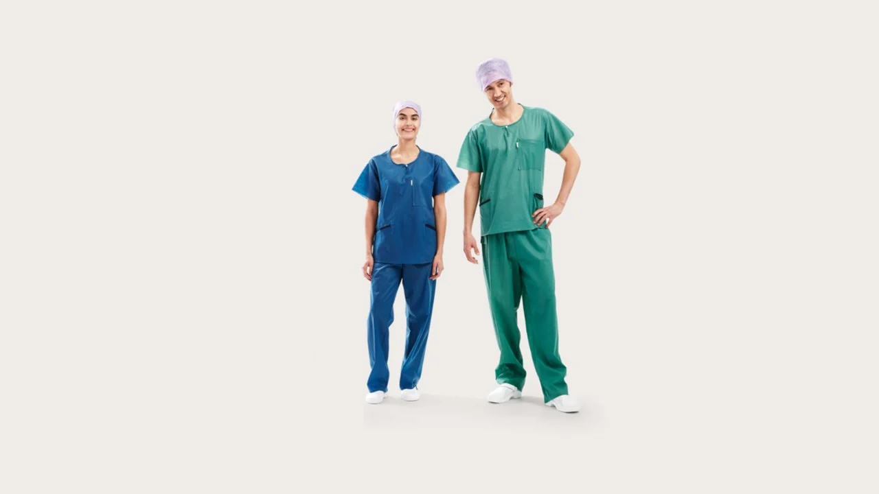 Three clinicians wearing BARRIER® Scrub Suit – extra comfort