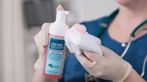 health care professional applying antiseptic product